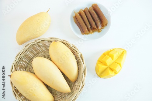 mango juice and mango sheets. Healthy fruit on a white background