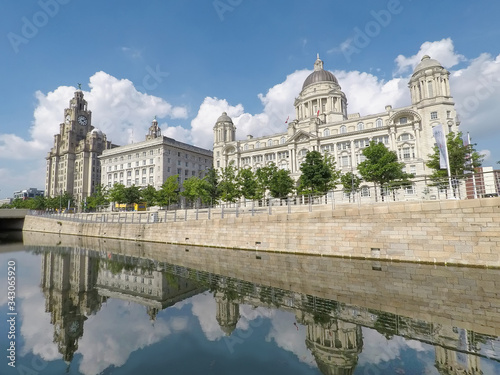 Liverpool city waterfront with beautiful architecture. The iconic Liver Birds, Three Graces, cathedrals and other landmarks along the River Mersey and UNESCO World Heritage Site.