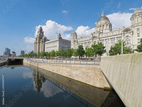 Liverpool's waterfront with the iconic Liver Birds, Three Graces, cathedrals and other landmarks on the River Mersey. UNESCO World Heritage Site status was bestowed 2004.