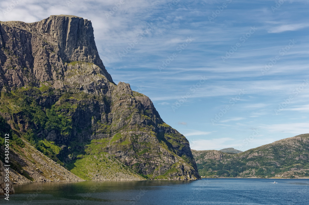 Some of the dramatic Cliff faces seen on the Geirangerfjord near Bergen on the West coast of Norway on a Summers day in August. Some of the dramatic Cliff faces seen on the Geirangerfjord near Bergen on the West coast of Norway on a Summers day in August.