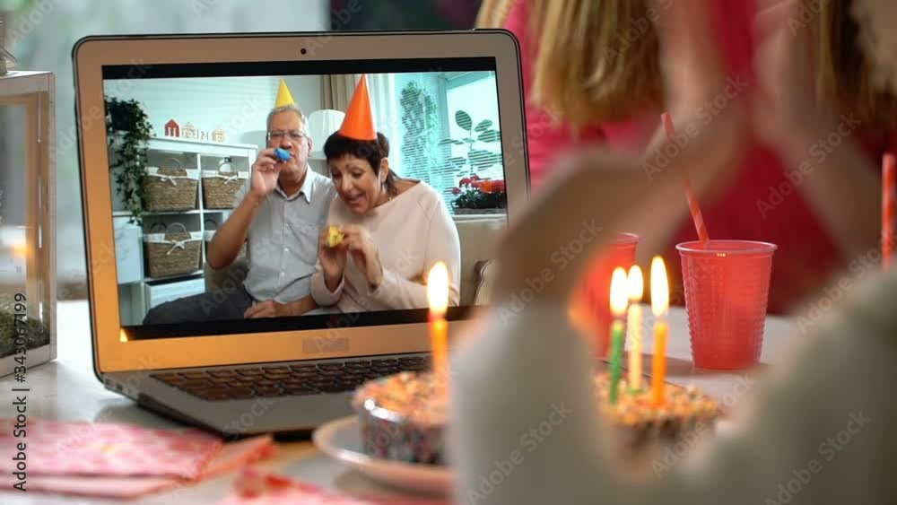 Happy Grandpa and Grandma Congratulate their Grandchildren Happy Birthday Using Laptop Video Call. Social distancing, self isolation during quarantine