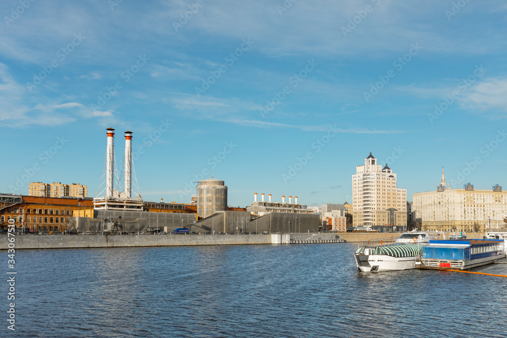 view of the industrial city on the river. River boats on the Moscow river