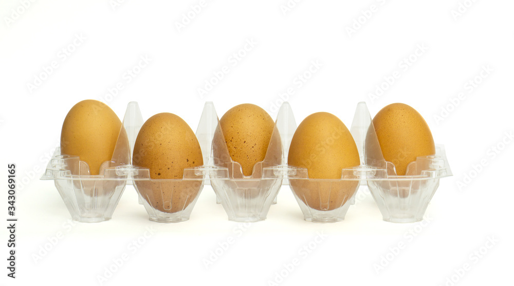 Eggs in a plastic package with isolated white background. Eggs in a plastic package with isolated white background.