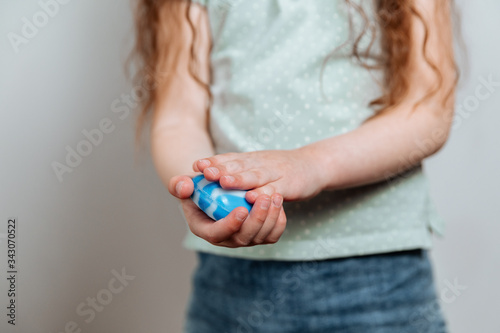 The girl avenges her hands with soap.