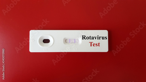 Positive Rotavirus test with sample of testing in rapid kit test for screening and diagnosis rota virus infection disease on background. Medical and infectious investigation concept