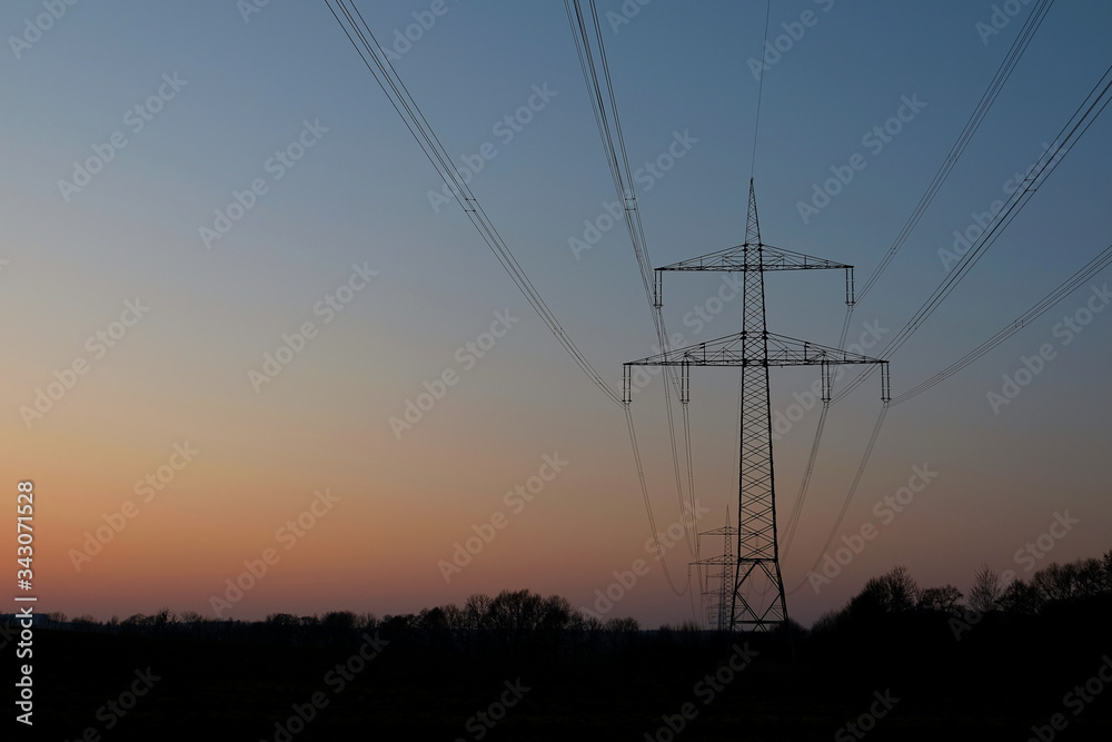 High Voltage Power Line Against Clear Sky 