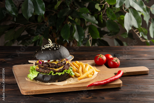 blackburger black mamba with marbled beef on a wooden table photo