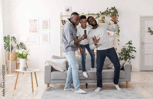 Family Fun. Joyful Black Dad, Son And Grandfather Fooling Together At Home