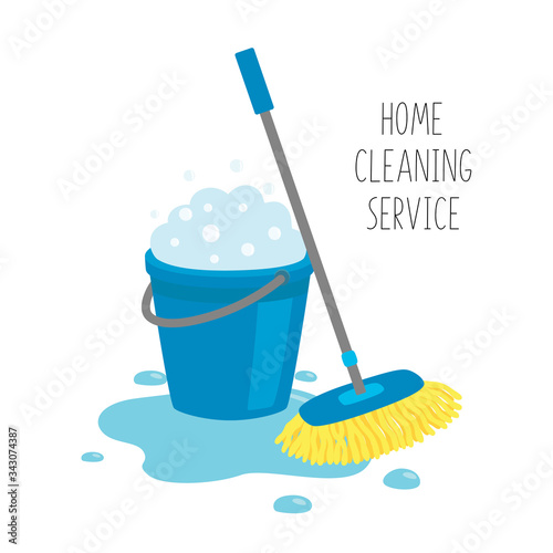 Home cleaning service. Mop and blue bucket full of soapy foam with bubbles, in a puddle of water .