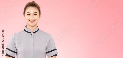 Foto Banner of Attractive Beautiful Asian woman maid smile and cross arm feeling so h
