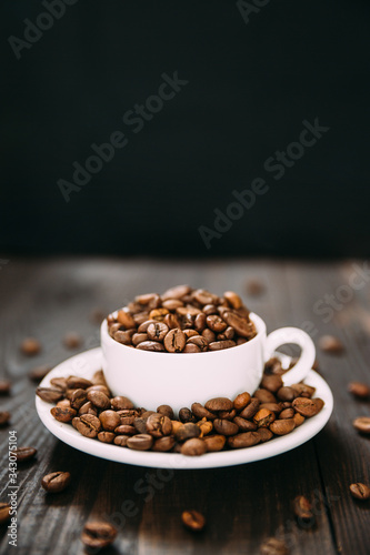 Fototapeta Naklejka Na Ścianę i Meble -  White cup and dish with coffee beans.