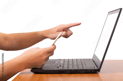 Man's hands pointing on screen laptop and useing smart phone for business at office desk