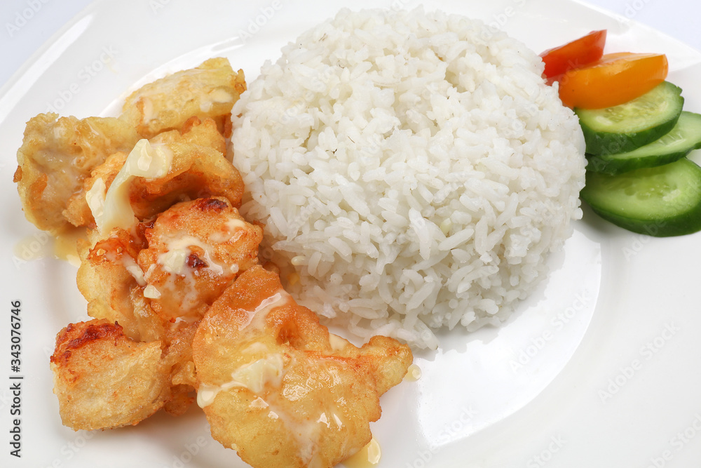 Butter Chicken Rice deep fried boneless chicken cube topped with sweet butter sauce with white rice cucumber and tomato slice Butter Chicken Rice deep fried boneless chicken cube topped with sweet butter sauce with white rice cucumber and tomato slice