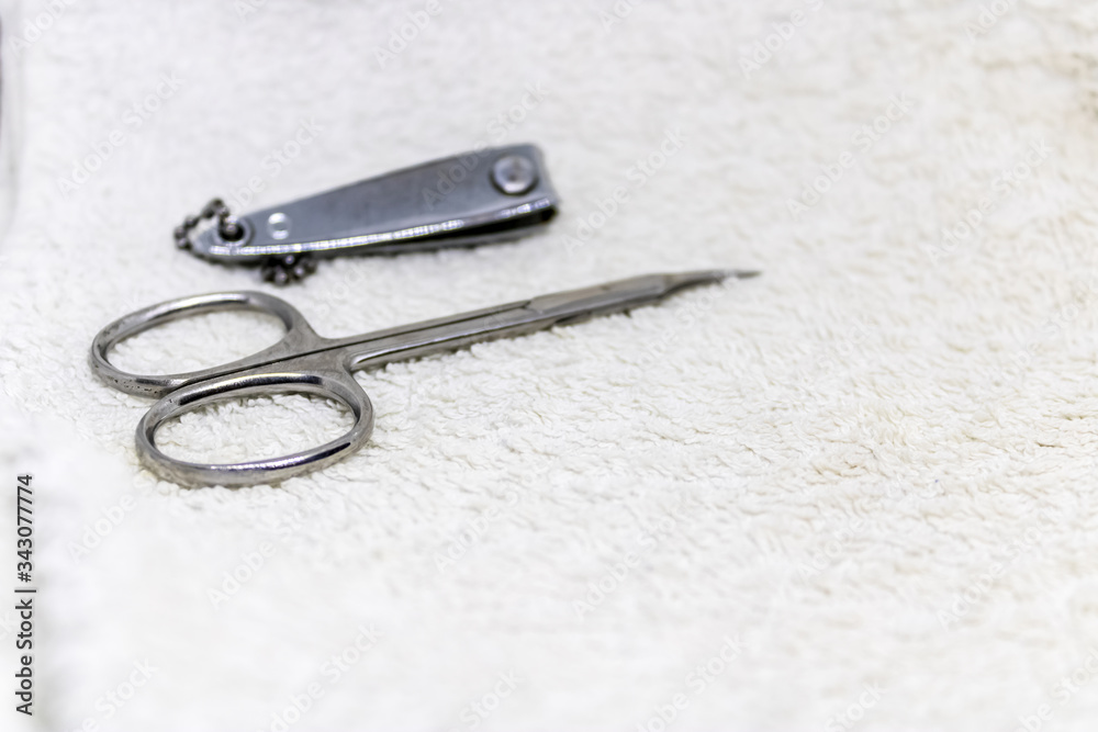 Manicure set close-up, nail scissors and nail clipper, nail cutting tools on white towel ready to use - Image Manicure set close-up, nail scissors and nail clipper, nail cutting tools on white towel ready to use - Image
