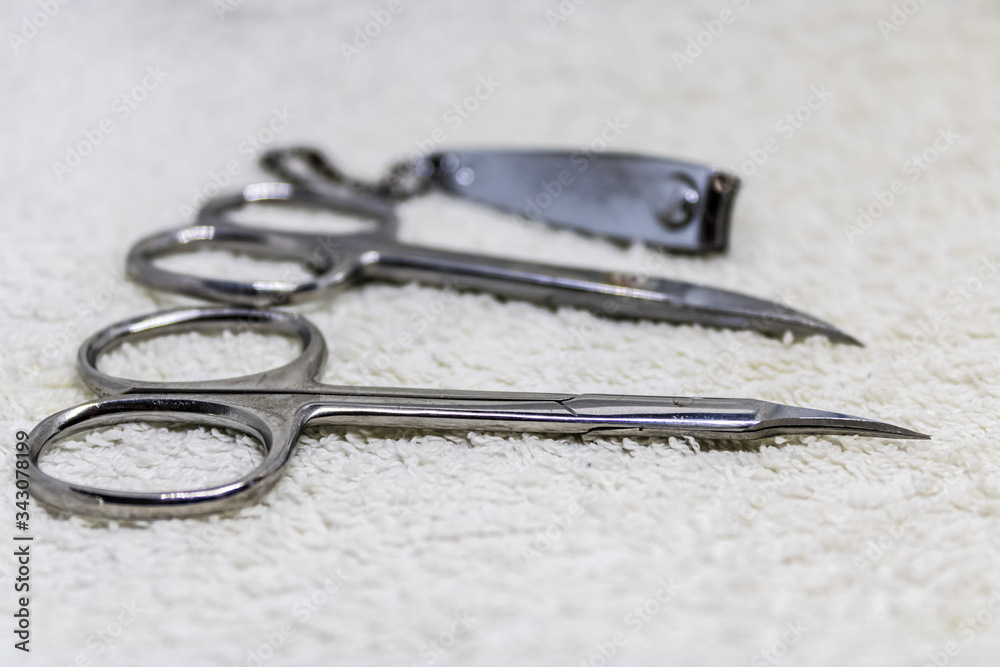 manicure instruments for nail care, nail clippers and nail scissors on white towel - Image manicure instruments for nail care, nail clippers and nail scissors on white towel - Image