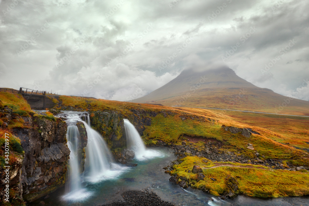 Kirkjufellsfoss waterfall in western Iceland during stormy weather