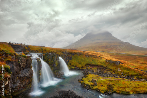 Kirkjufellsfoss waterfall in western Iceland during stormy weather