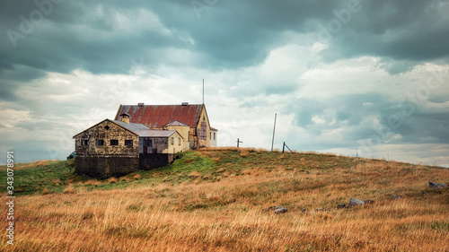 Lonely Barn Sitting on a Hill during Stormy Weather