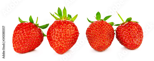 Strawberries with leaves isolated on a white background.