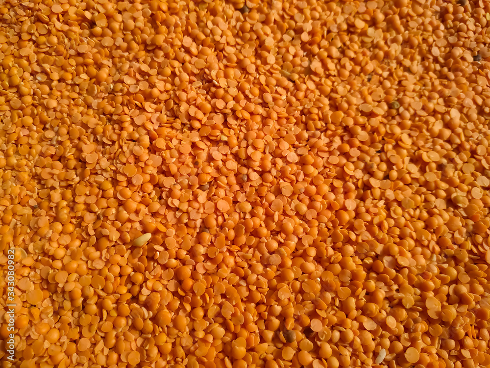 Red raw organic lentils texture. Food ingredient background. Natural Red raw organic lentils texture. Food ingredient background. Natural