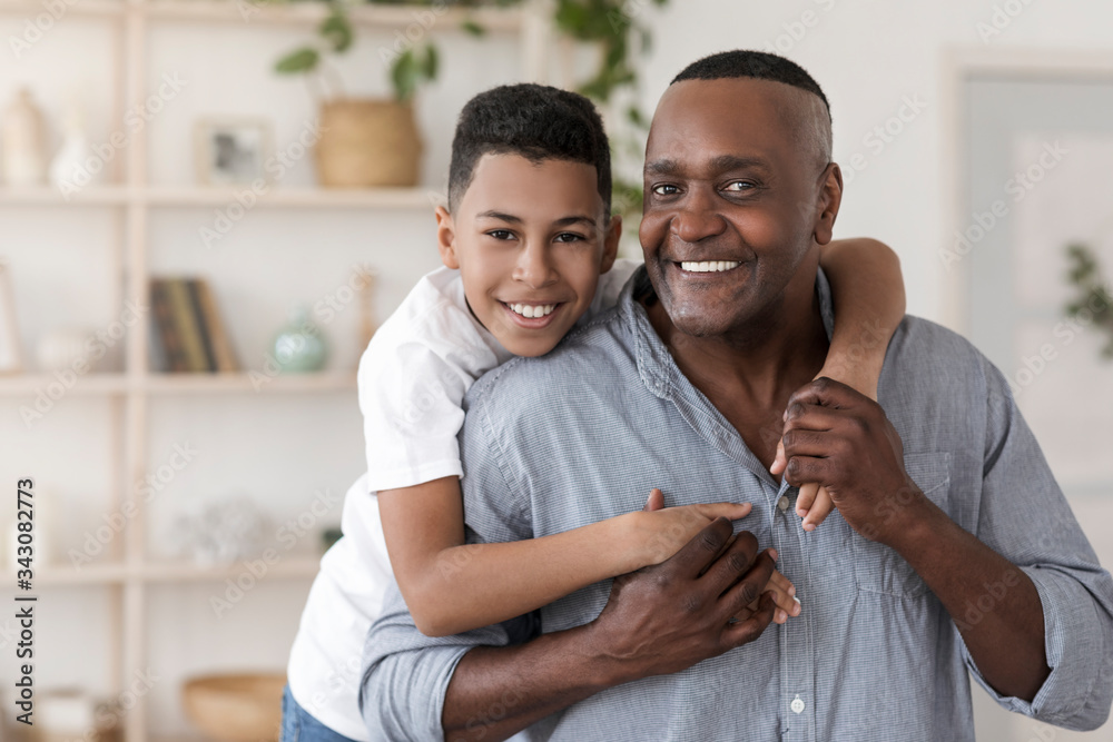 Family Bonding. Portrait Of Happy Black Preteen Boy Embracing His Grandfather - obrazy, fototapety, plakaty 