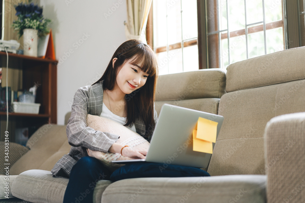 Asian teenager woman call with team via internet social distance and stay at home Asian teenager woman call with team via internet social distance and stay at home