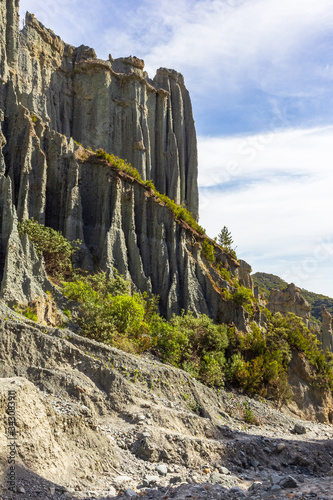 Portrait of grey cliffs of Putangirua Pinnacles. North Island, New Zealand photo