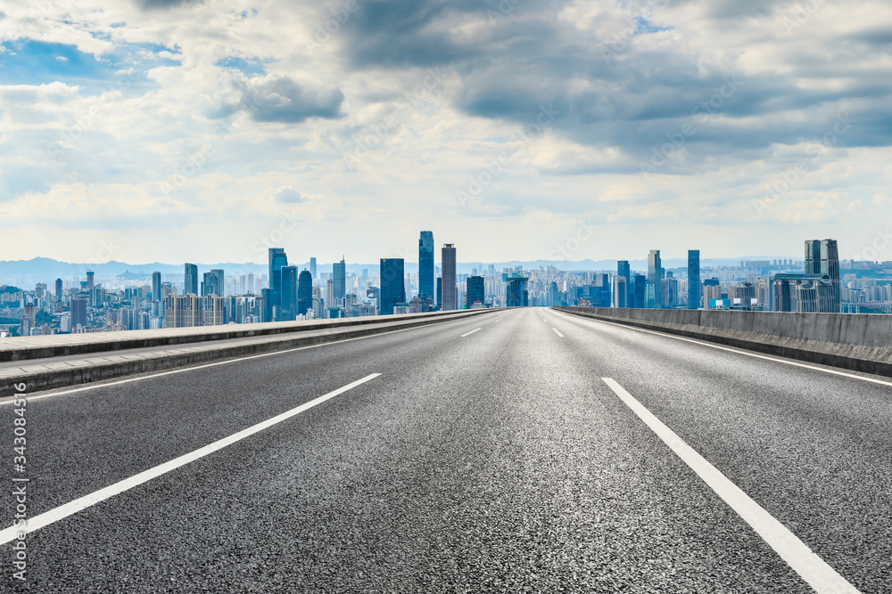 Empty asphalt road and Chongqing city skyline and buildings scenery,China.