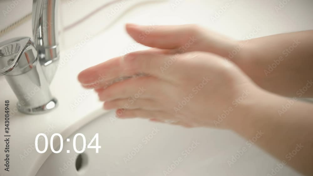 Hand wash. The woman is washing her hands by surgical methods. Protection from Coronavirus. Wash your hands for at least 20 seconds. Hand wash. The woman is washing her hands by surgical methods. Protection from Coronavirus. Wash your hands for at least 20 seconds.