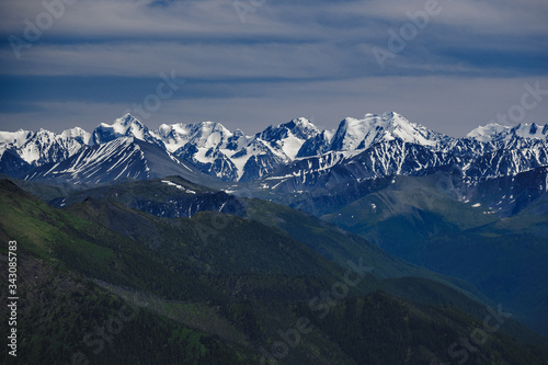 Spectacular view from the top of the mountain to the mountain range in the Ulagansky District of the Altai republic, Russia