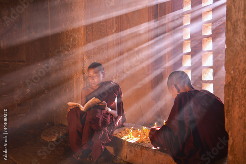 Novice monks in the plain of bagan with candle,Myanmar