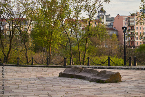 Landscape Alley with old stone in Kyiv in April. Translation: 