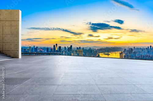 Empty square floor and chongqing city skyline at sunset China.