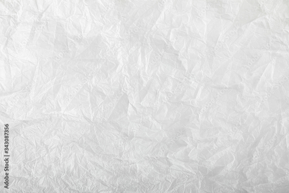 White crumpled paper texture background. Clean white crumpled paper. Flat lay, top view, copy space