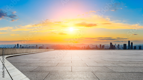 Empty square floor and chongqing city skyline at sunset China.