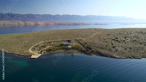 Stone desert island of Zecevo church and landscape aerial footage, Zadar archipelago of Croatia