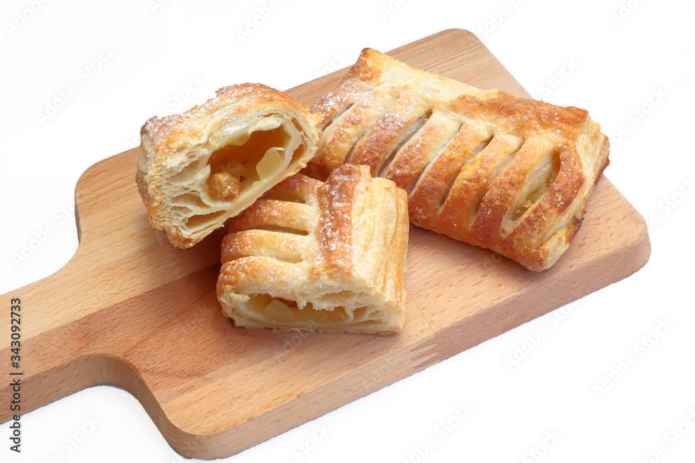 ITALIAN CRISPY DESSERT PASTRY ON A WOODEN CUTTING BOARD ITALIAN CRISPY DESSERT PASTRY ON A WOODEN CUTTING BOARD