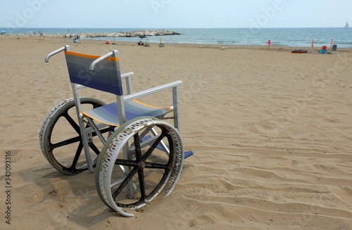 empty wheelchair on the beach