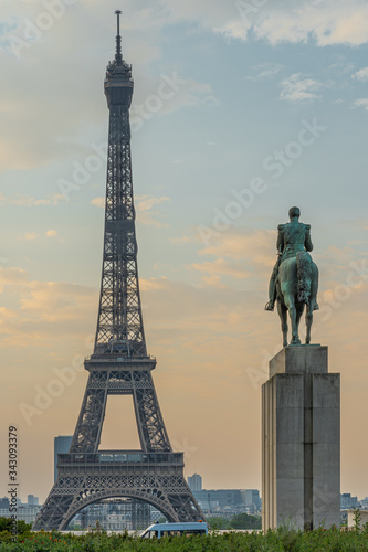 Paris, France - 04 25 2020: View of the Eiffel Tower from the place of the trocadero and the equestrian statue of Marshal Foch during the coronavirus period