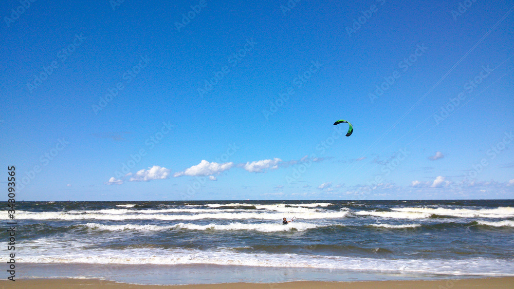 Kitesurfing beach, sea vacation, blue sky, blue water
