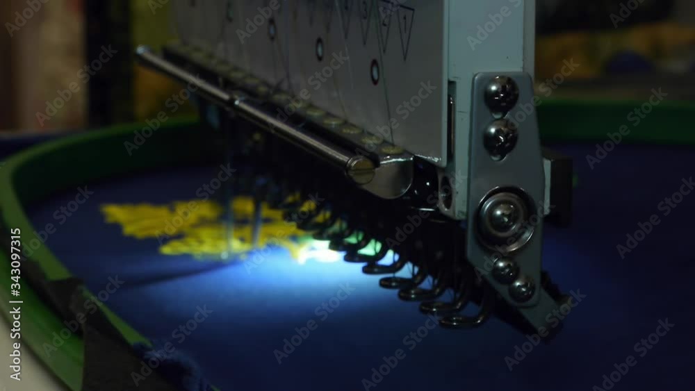 Programmable sewing machine. Embroidery machine. The robot sews a pattern on the fabric. Work at home, freelance. Programmable sewing machine. Embroidery machine. The robot sews a pattern on the fabric. Work at home, freelance.