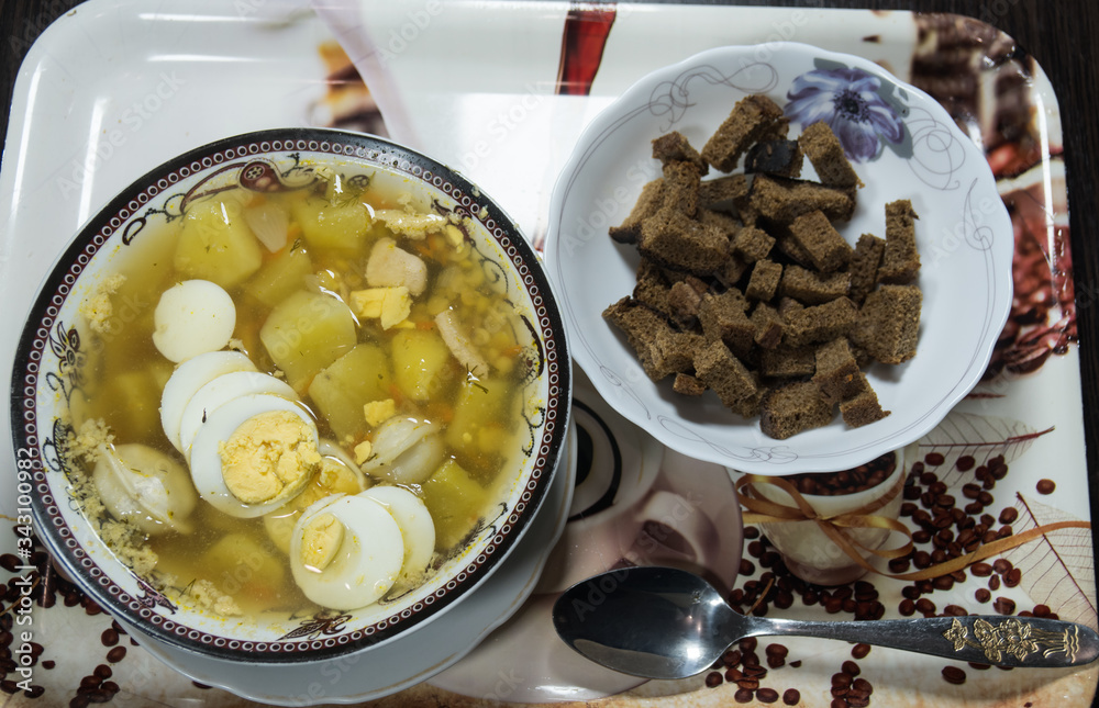 Chicken soup with noodles, carrots, eggs and cheese croutons Chicken soup with noodles, carrots, eggs and cheese croutons