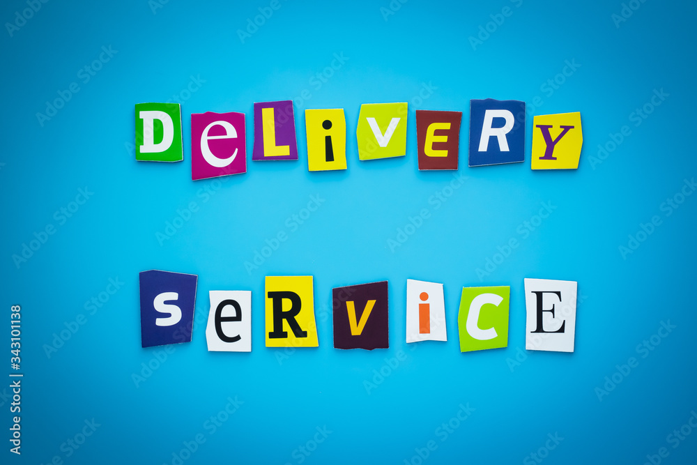 Obraz premium A word writing text - delivery service. Cartoon colorful letters on a blue background. Headline, banner with inscription font.