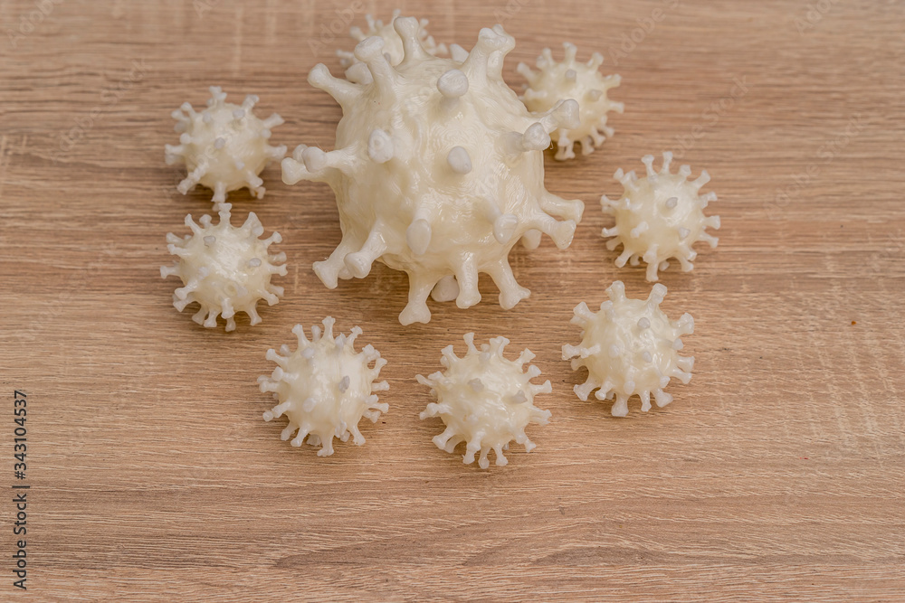 covid19, 3d printed representation of the virus on a wooden surface. home security and protection against viruses covid19, 3d printed representation of the virus on a wooden surface. home security and protection against viruses