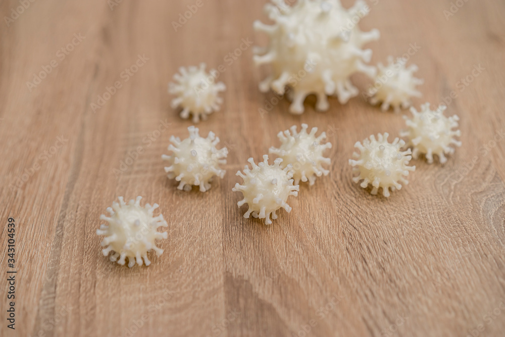 covid19, 3d printed representation of the virus on a wooden surface. home security and protection against viruses covid19, 3d printed representation of the virus on a wooden surface. home security and protection against viruses
