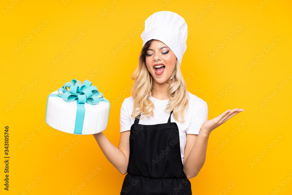 Teenager girl pastry holding a big cake isolated on yellow background unhappy and frustrated with something Teenager girl pastry holding a big cake isolated on yellow background unhappy and frustrated with something