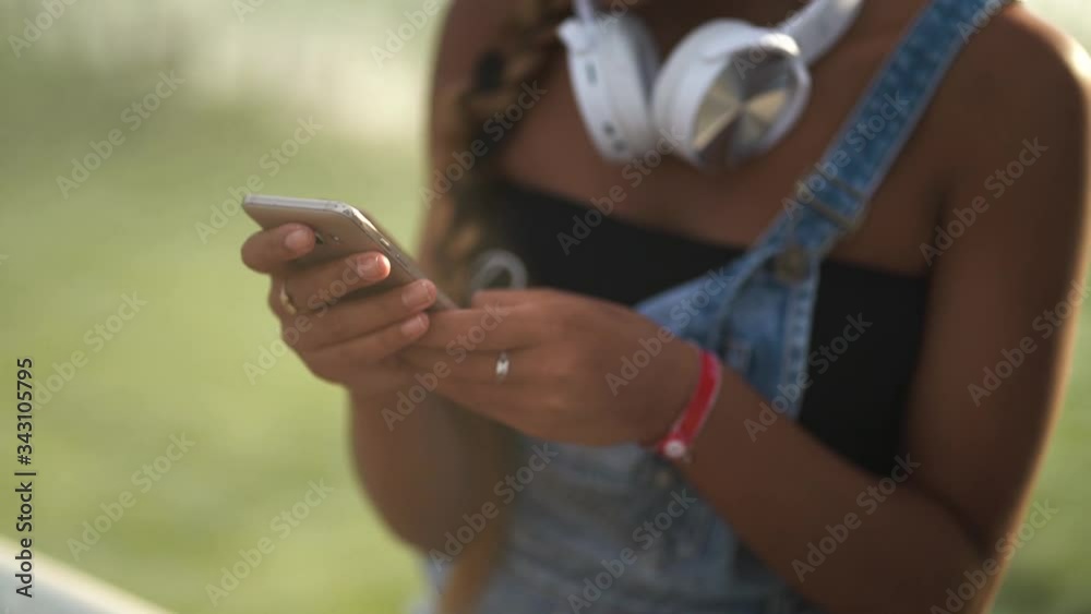 close up of female hands use app on smartphone close up of female hands use app on smartphone