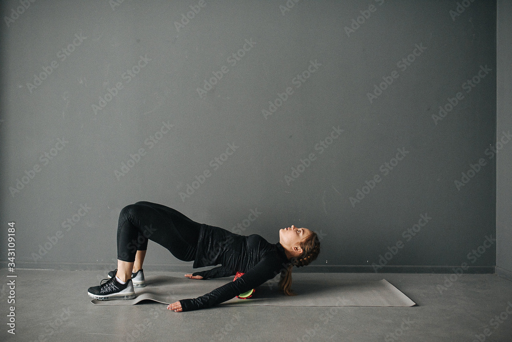 Caucasian female sportswoman stretching muscles in workout in pilates studio. Set photo with film photo gain. Caucasian female sportswoman stretching muscles in workout in pilates studio. Set photo with film photo gain.