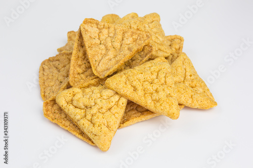 healthy snack of baked, not fried chickpea chips with yogurt and cucumber flavor