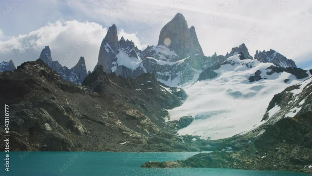 Crystal Clear Lake by the Foot of the Snow-Covered El Chalten Mountain Crystal Clear Lake by the Foot of the Snow-Covered El Chalten Mountain